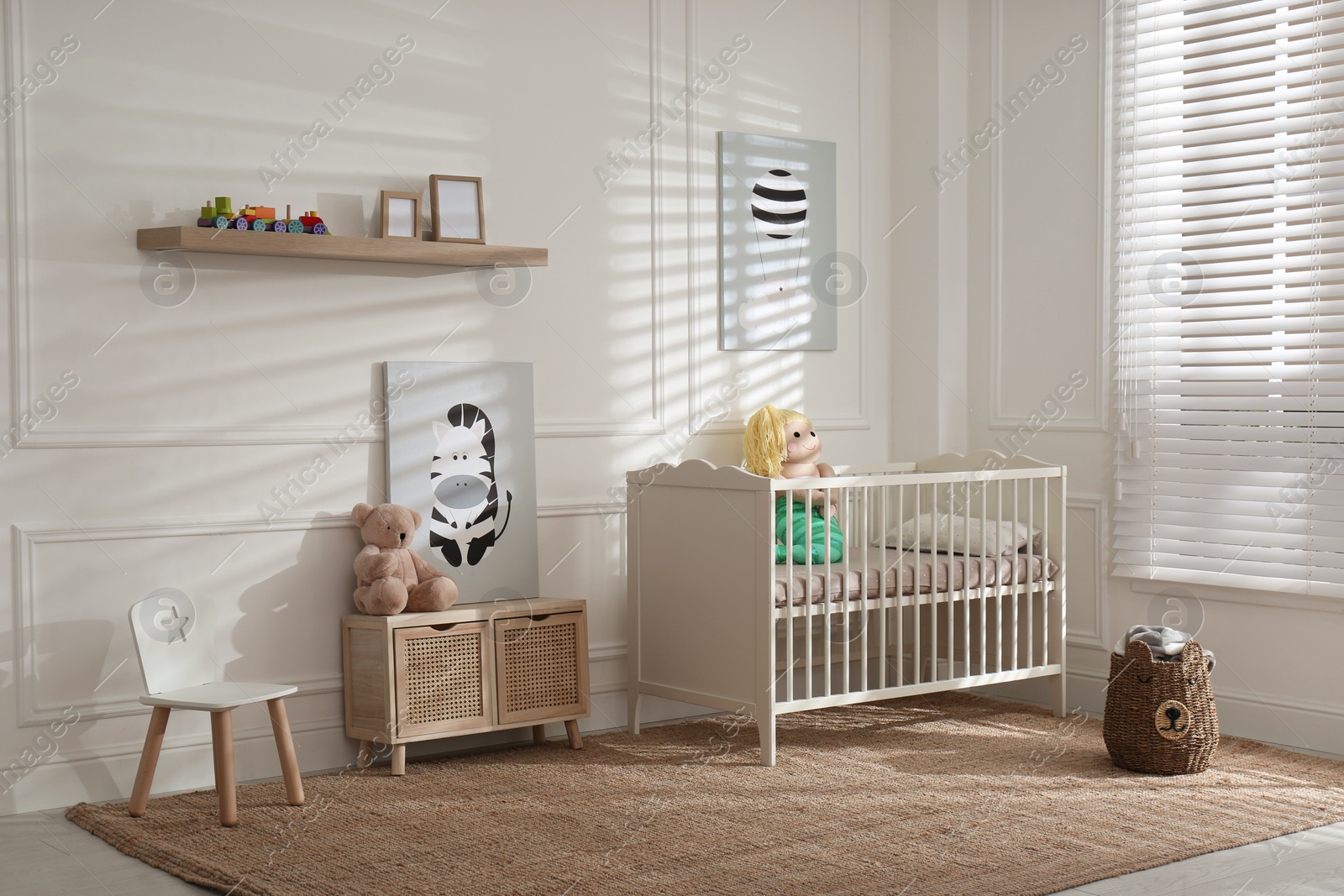 Photo of Light baby room interior with comfortable crib