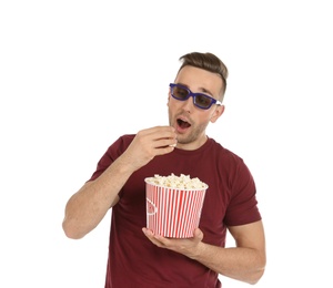 Man with 3D glasses and popcorn during cinema show on white background