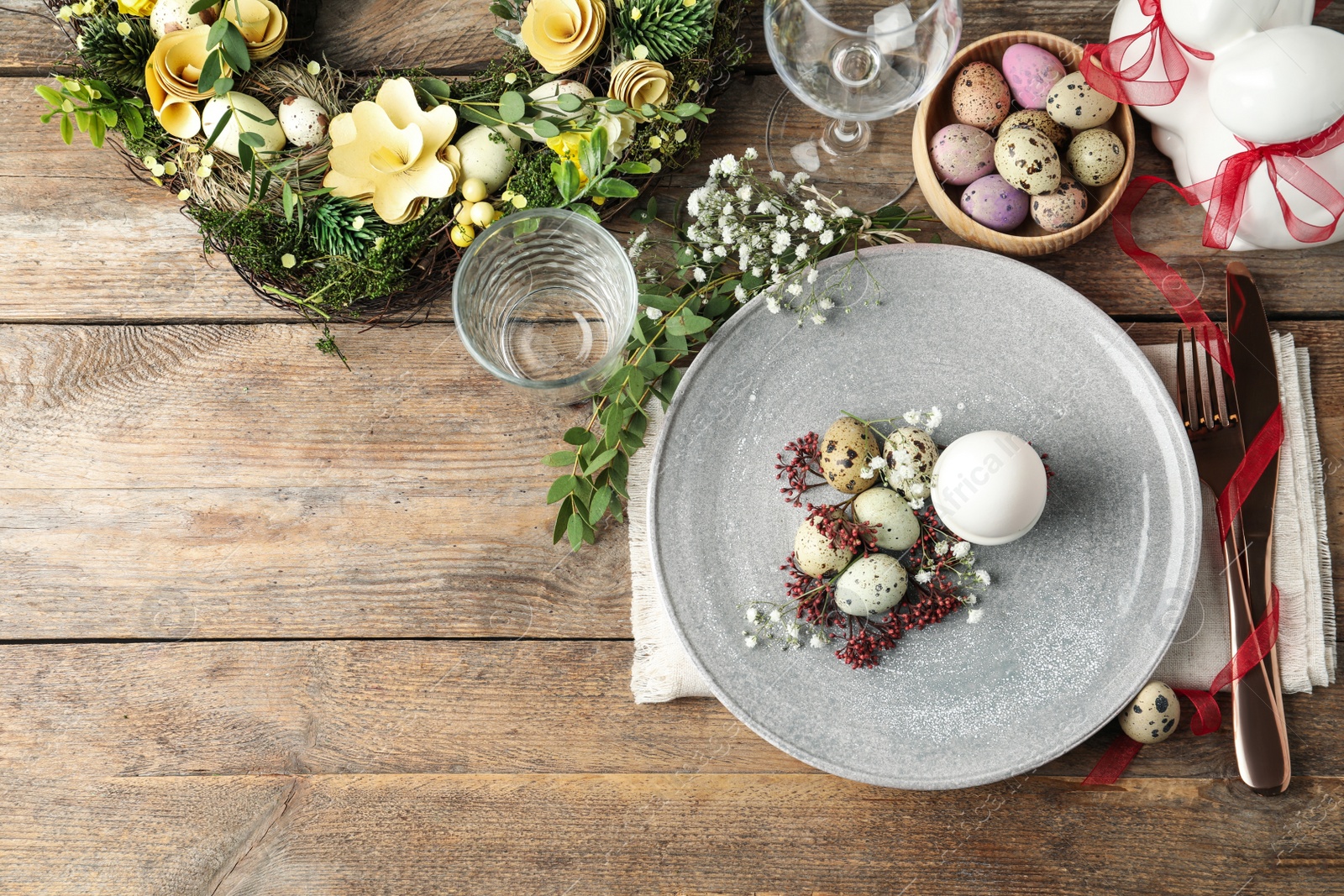 Photo of Festive Easter table setting with beautiful floral decor, flat lay. Space for text