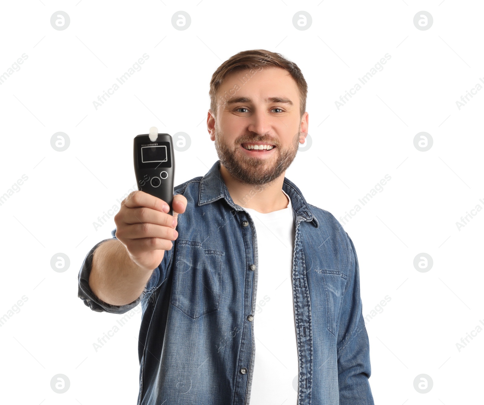 Photo of Happy man with breathalyzer on white background