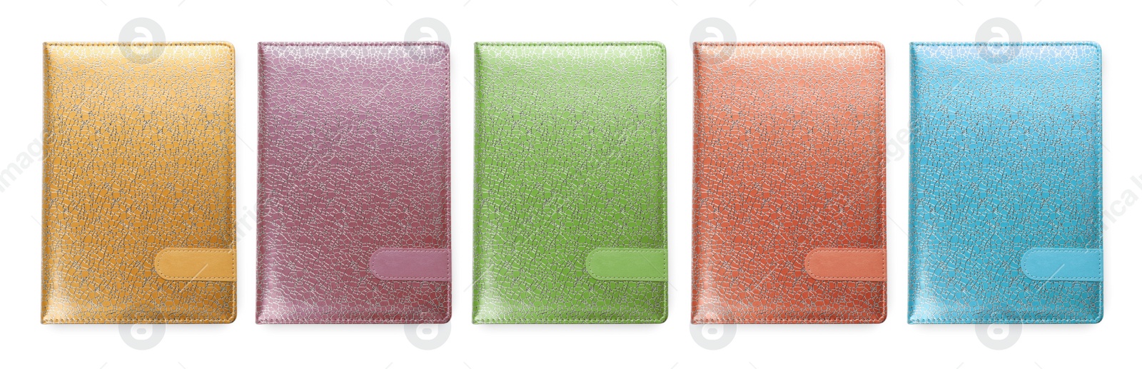 Image of Set with different multicolored planners on white background, top view. Banner design