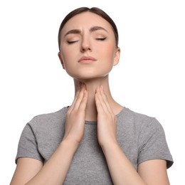 Young woman with sore throat on white background