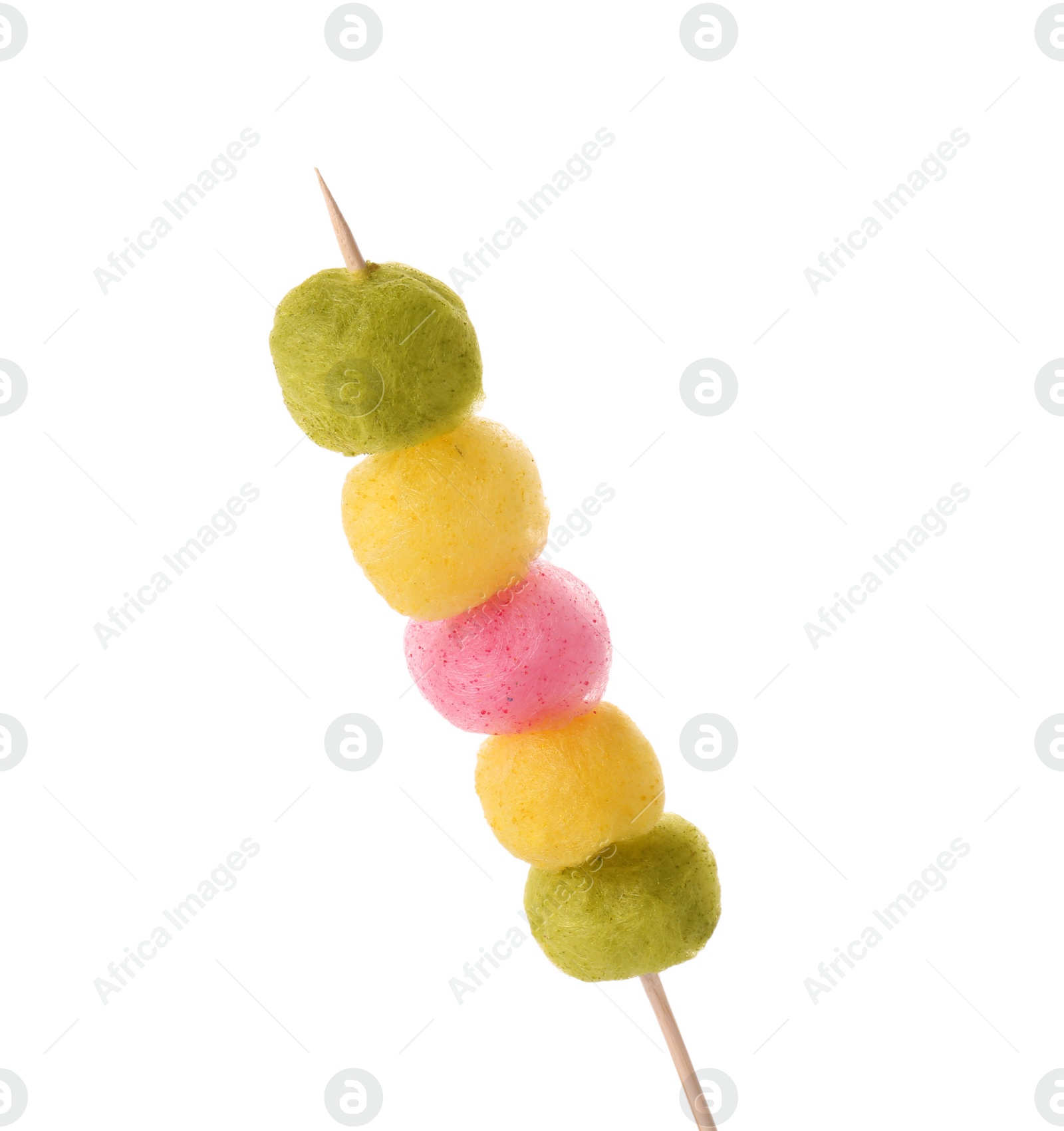 Photo of Skewer with color cotton balls isolated on white. Sweet candy