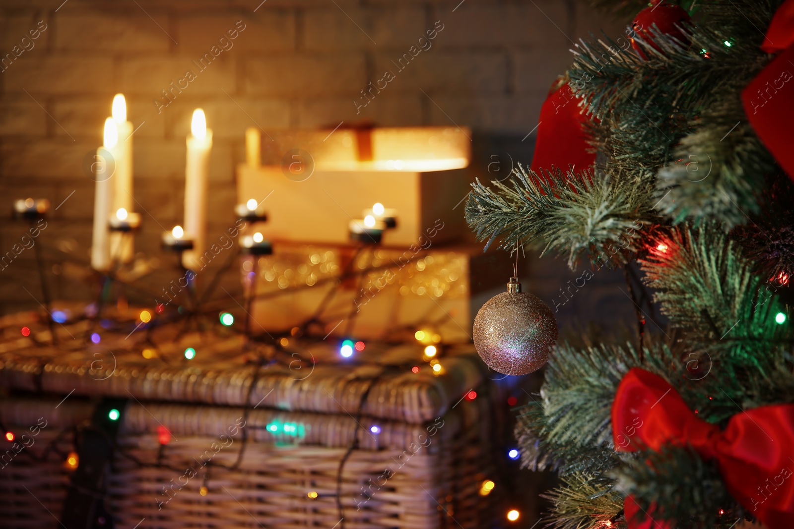 Photo of Christmas tree with beautiful decorations indoors, closeup. Stylish interior element