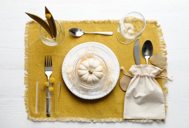 Photo of Autumn table setting with pumpkin on white wooden background, flat lay