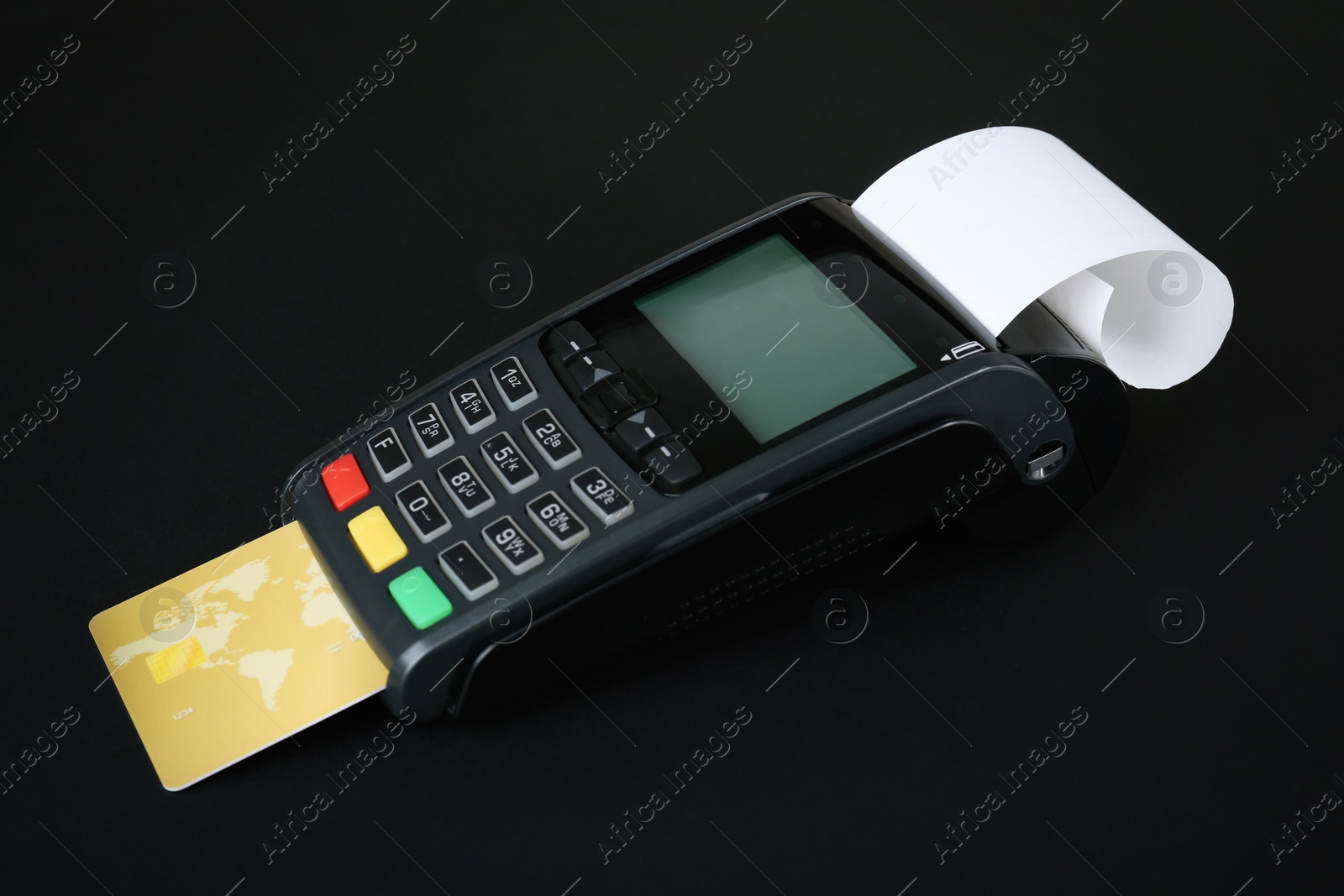 Photo of New modern payment terminal with credit card on black background