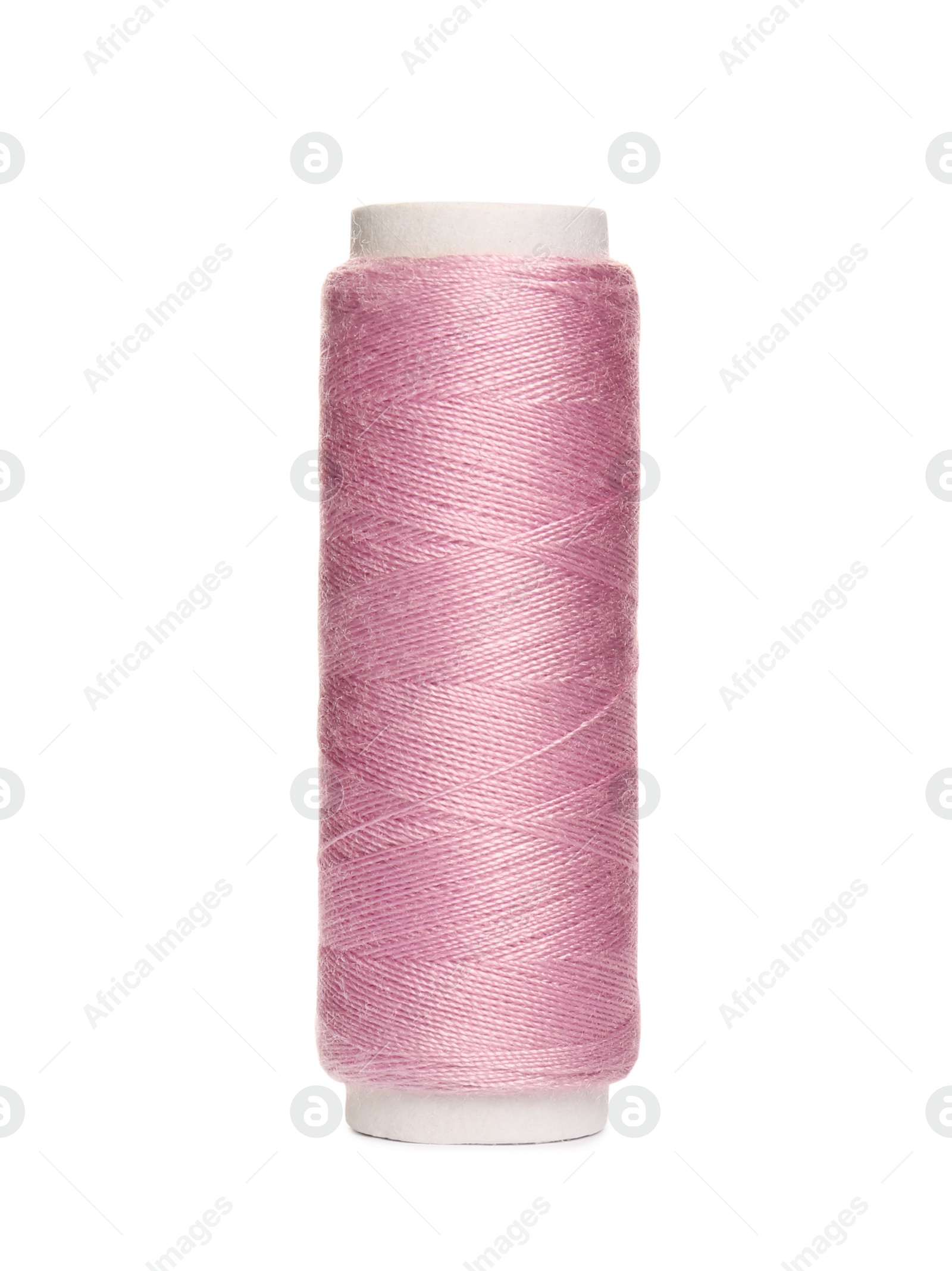 Photo of Spool of pink sewing thread isolated on white