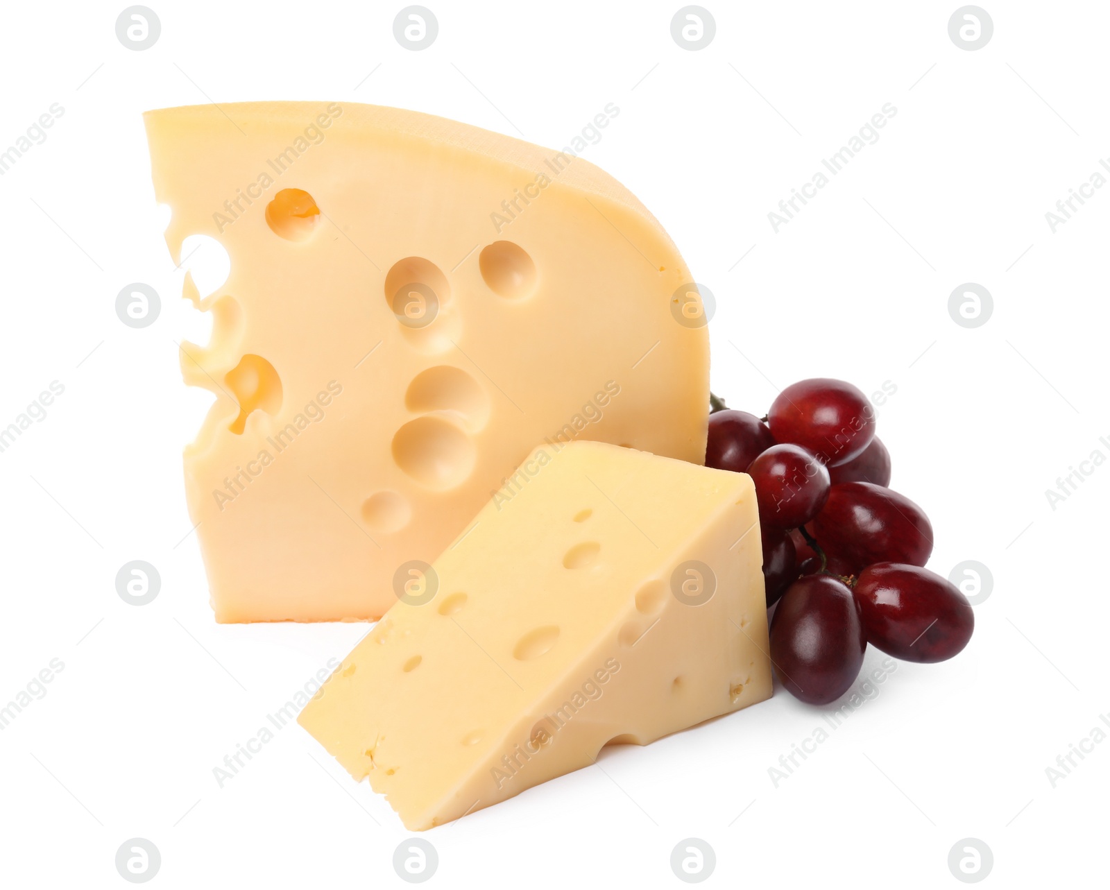 Photo of Pieces of delicious cheese and grapes isolated on white