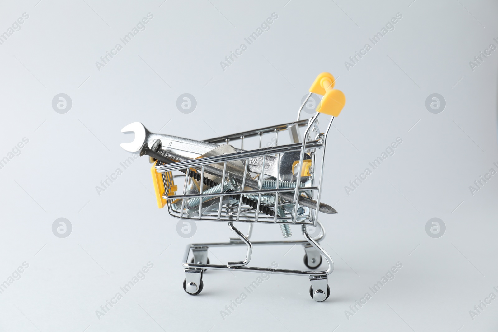 Photo of Different construction tools on light grey background