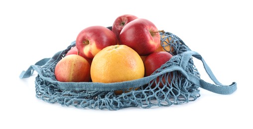 String bag with apples and orange isolated on white
