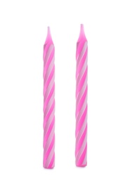 Photo of Pink striped birthday candles isolated on white