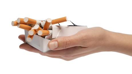 Stop smoking. Man holding pack with cigarettes on white background, closeup