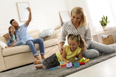 Happy family spending time together at home