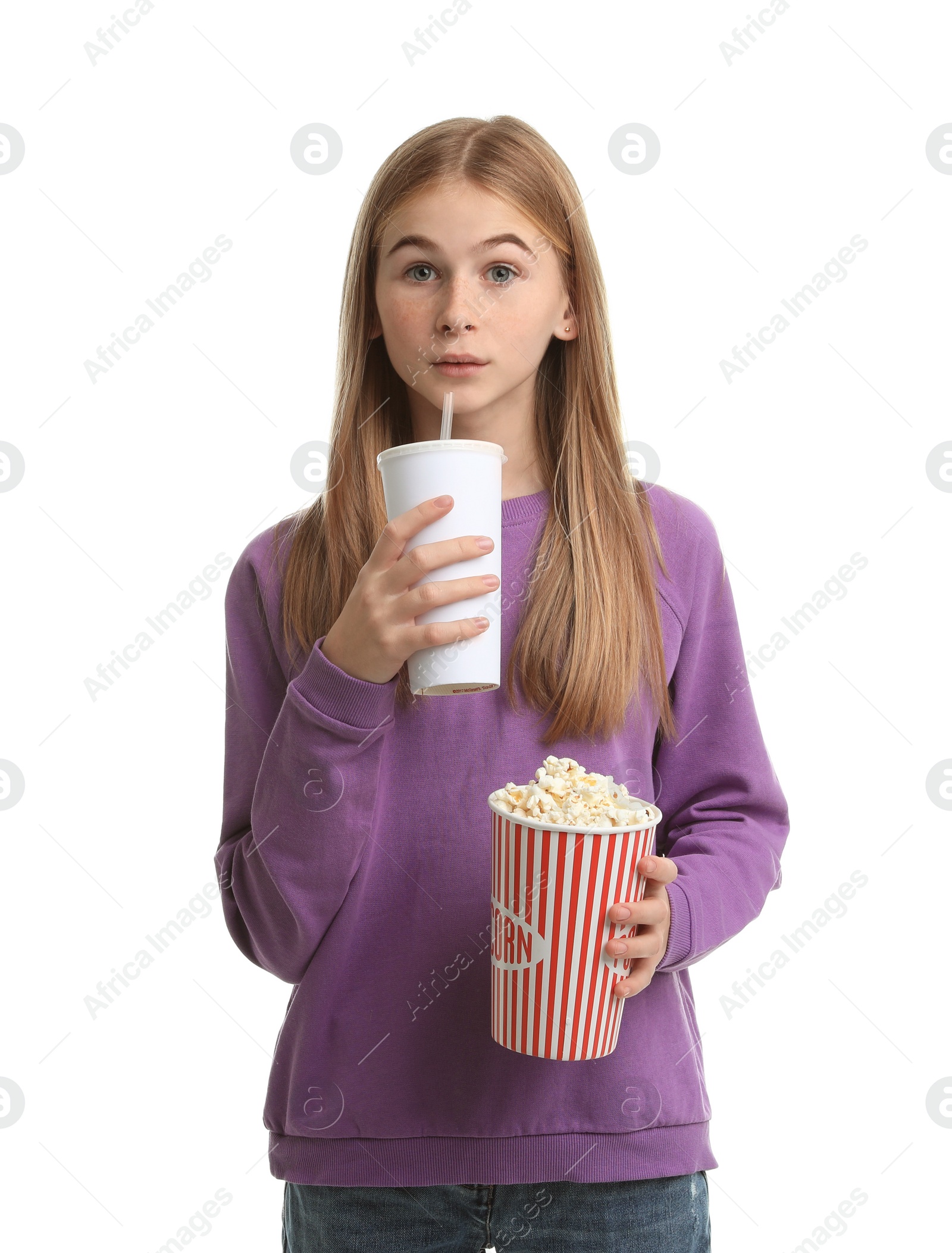 Photo of Emotional teenage girl with popcorn and beverage during cinema show on white background