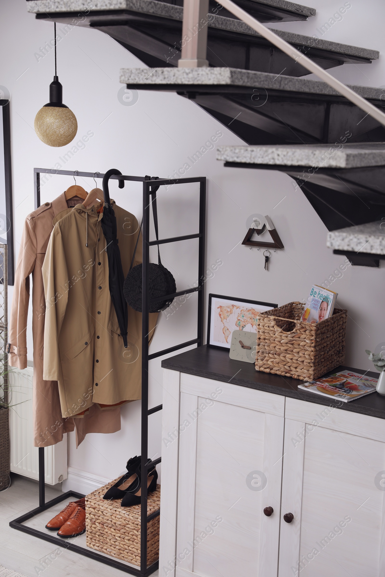 Photo of Modern hallway interior with stylish furniture and key holder