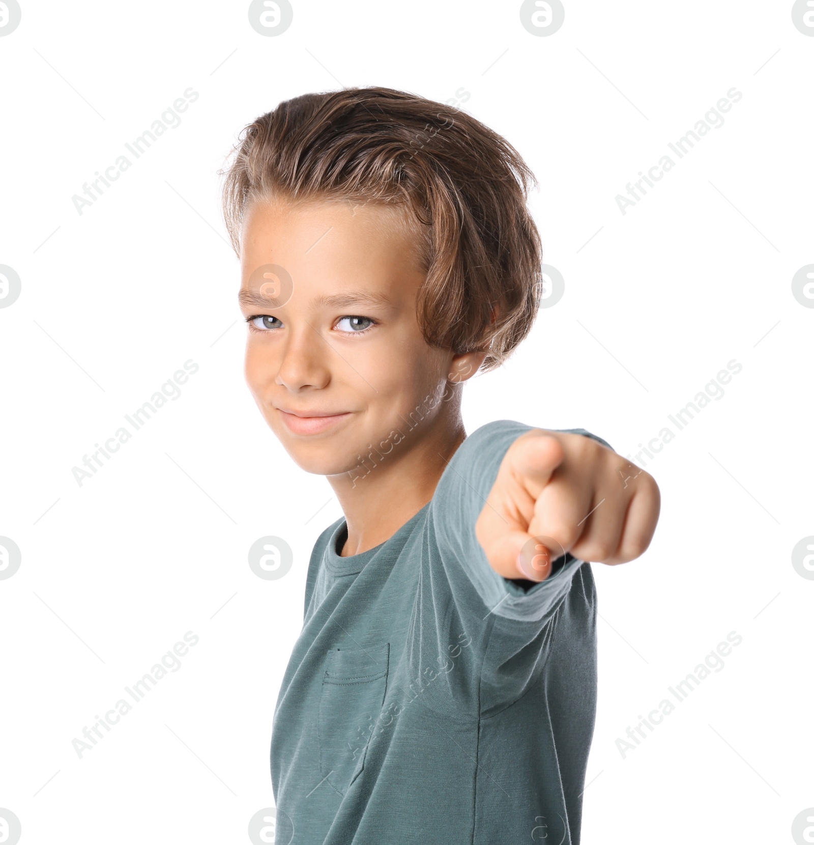 Photo of Portrait of cute little boy in casual outfit on white background