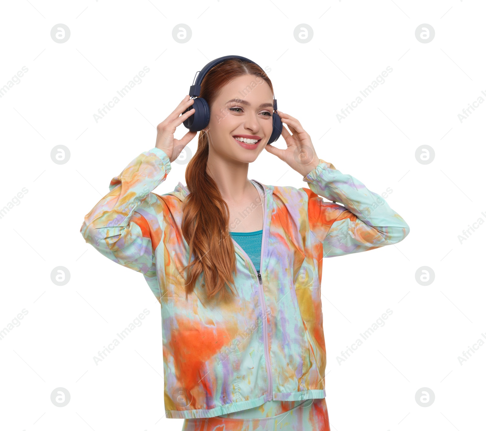 Photo of Young woman in sportswear and headphones on white background