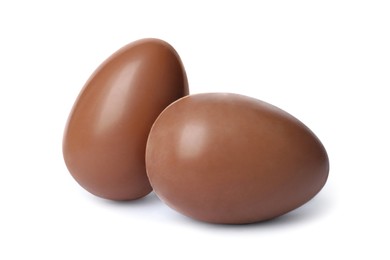 Photo of Two tasty chocolate eggs isolated on white