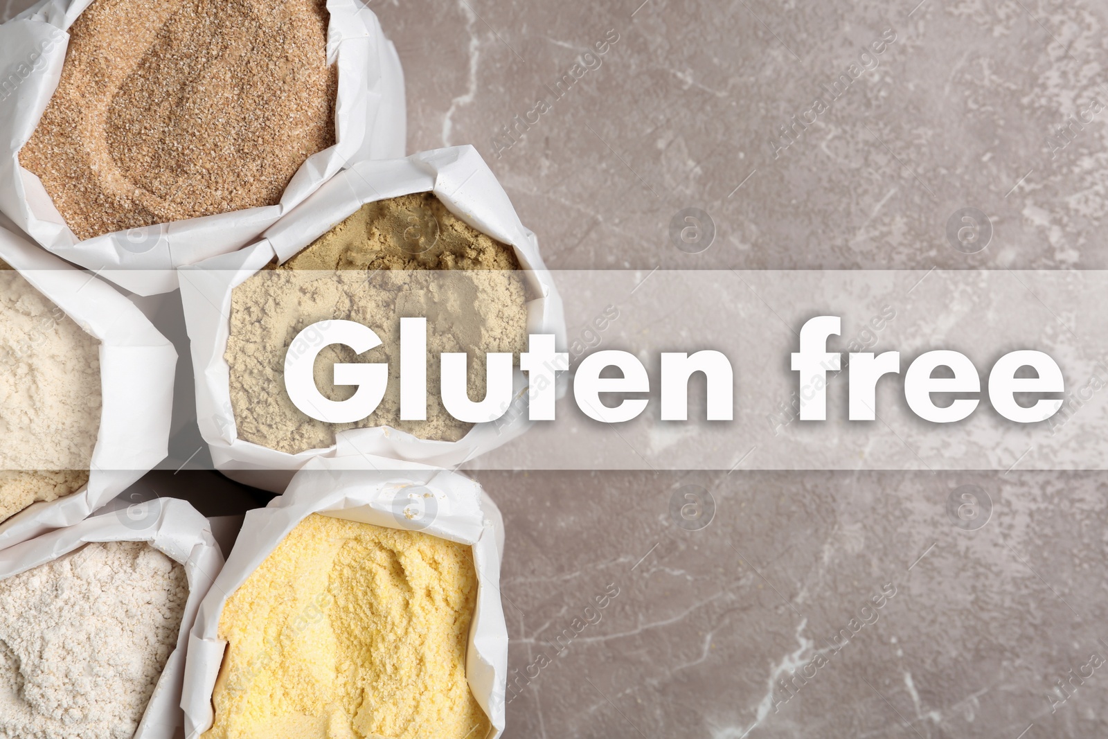Image of Gluten free products. Bags with different types of flour on grey table and text, top view