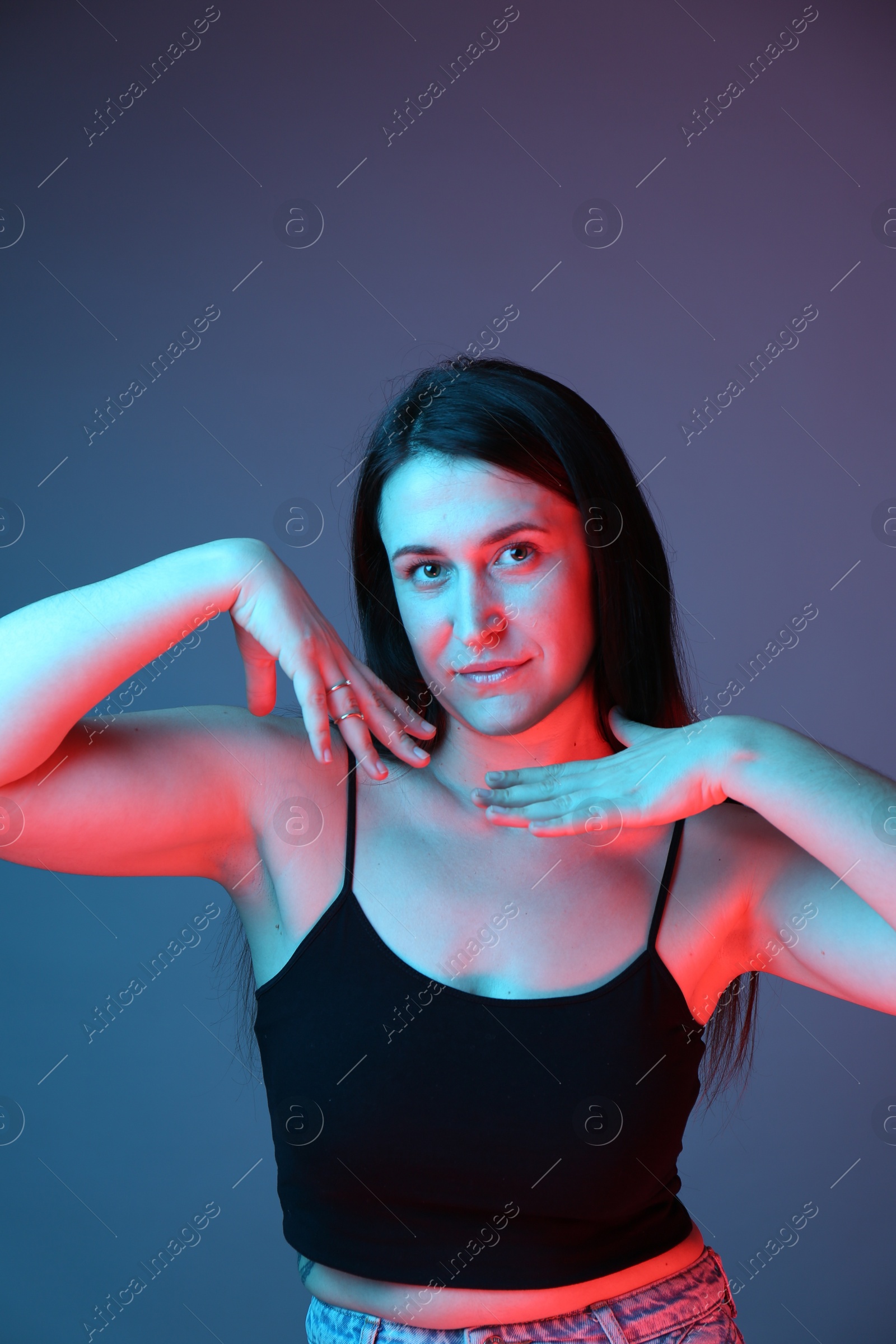 Photo of Portrait of beautiful young woman on color background