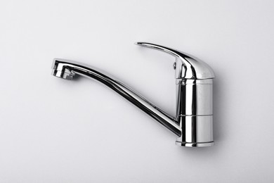 Photo of Single handle water tap on grey background, top view