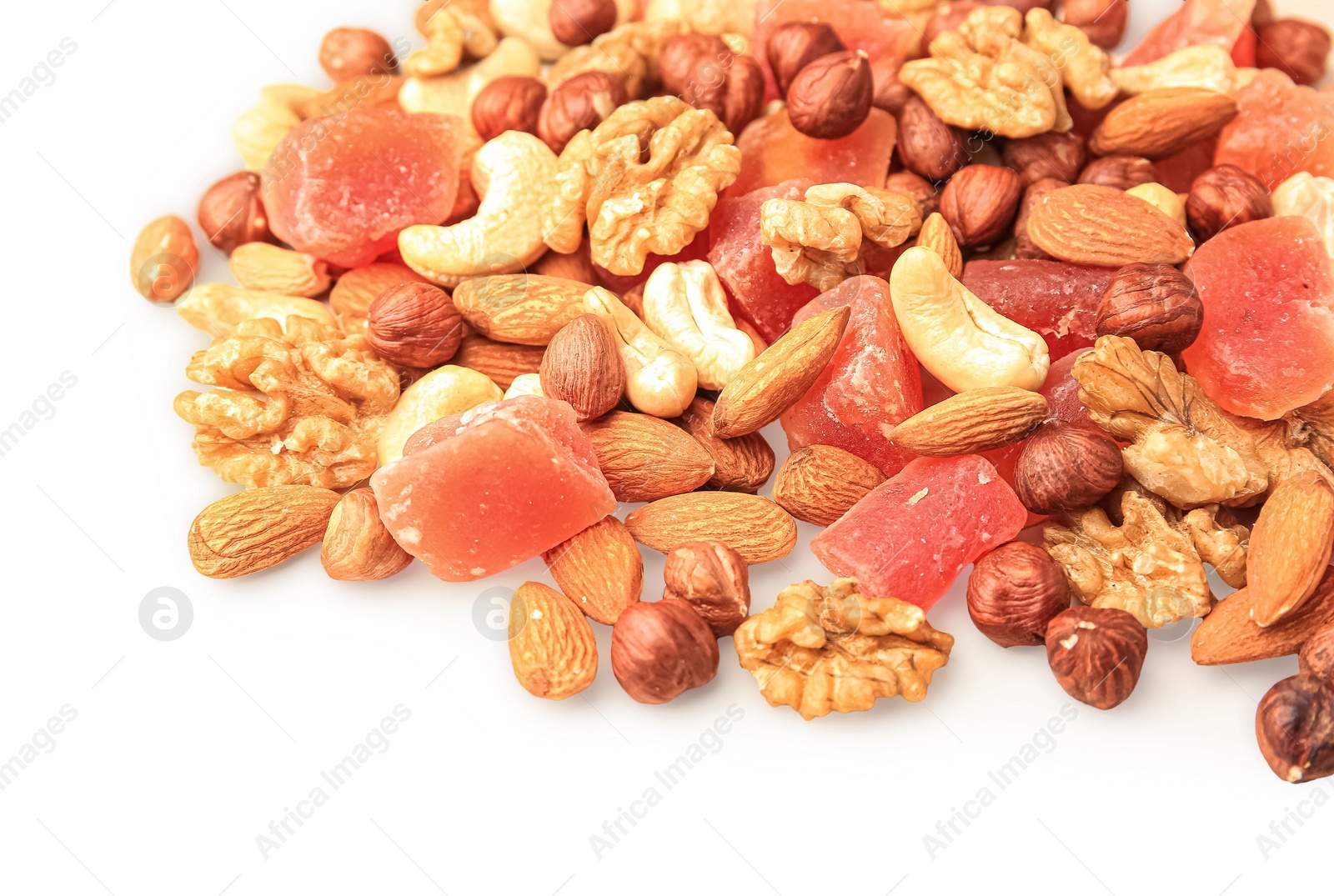 Photo of Different tasty nuts and dried papayas on beige background, space for text