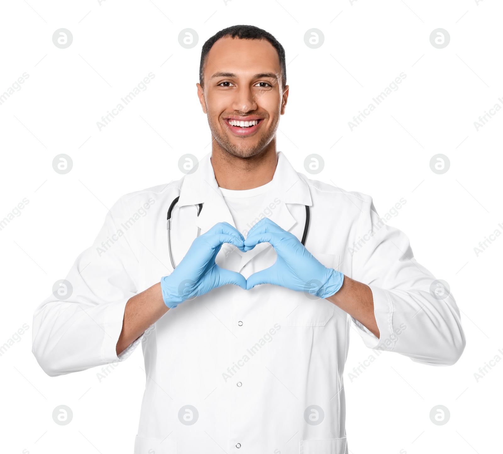 Photo of Doctor or medical assistant (male nurse) making heart with hands on white background