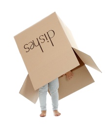 Photo of Cute little child playing with cardboard box on white background