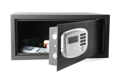 Photo of Open steel safe with money and jewelry isolated on white