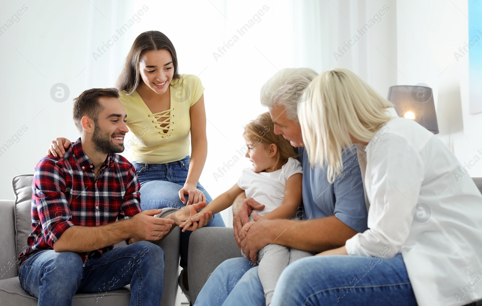 Photo of Happy family at home. Reunion of generations