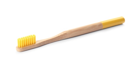 Photo of Toothbrush made of bamboo on white background