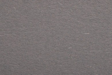 Photo of Texture of grey paper sheet as background, top view