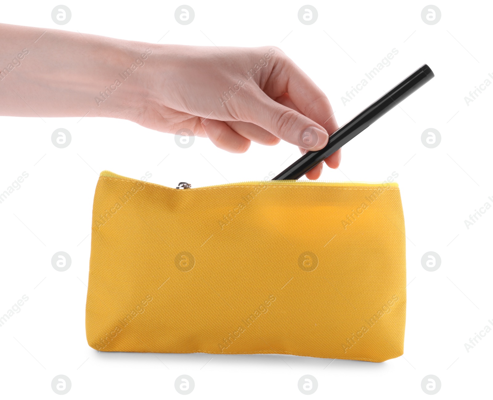 Photo of Woman taking out eyeliner from yellow cosmetic bag on white background, closeup