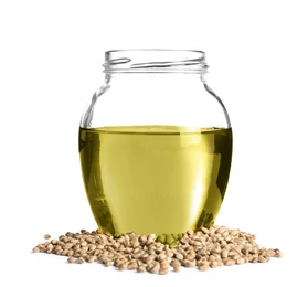 Photo of Jar with hemp oil and seeds on white background