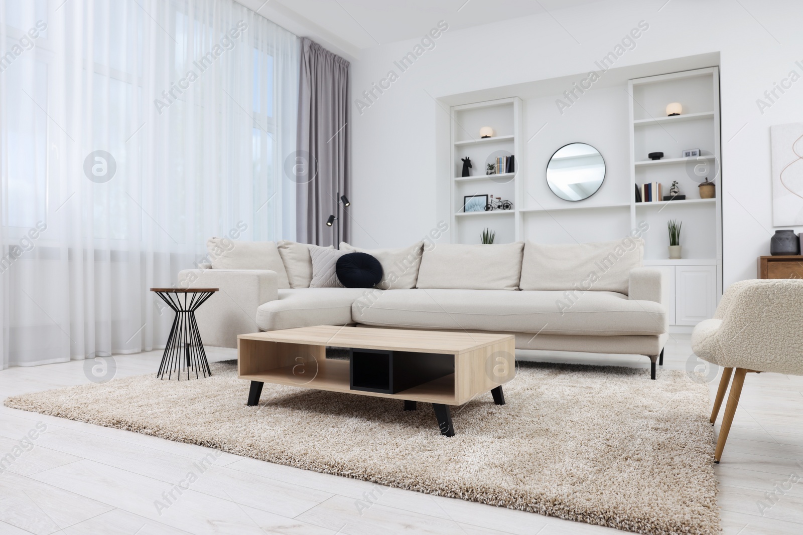 Photo of Beautiful carpet, furniture and accessories in living room