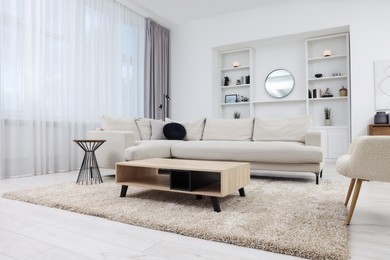 Photo of Beautiful carpet, furniture and accessories in living room