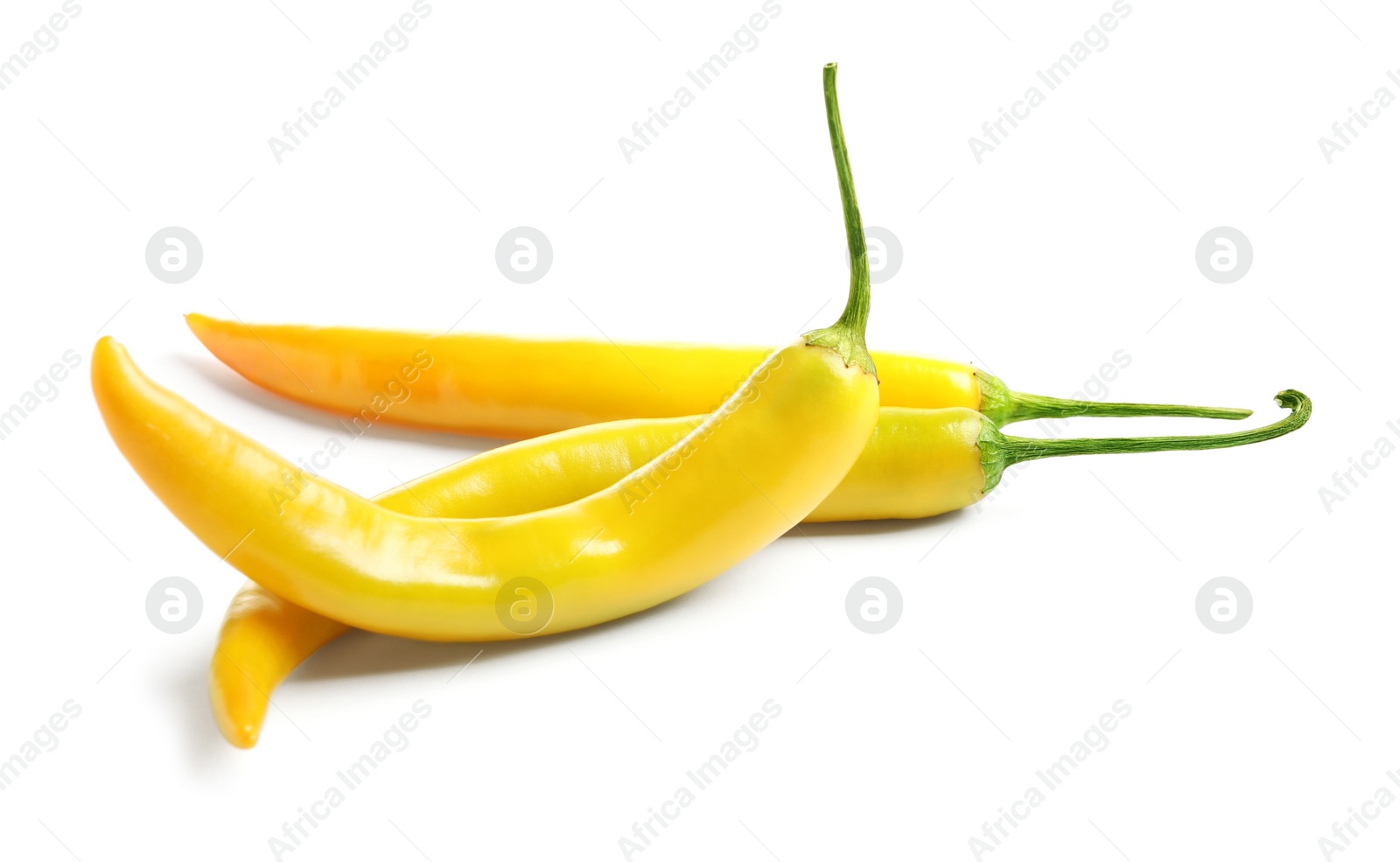 Photo of Ripe yellow hot chili peppers isolated on white