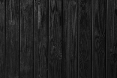 Photo of Texture of black wooden surface as background, top view