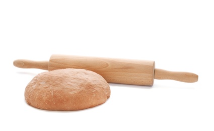 Photo of Raw rye dough and rolling pin on white background