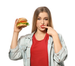Pretty woman with tasty burger isolated on white