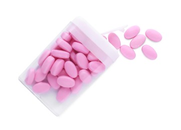 Photo of Tasty pink dragee candies with box on white background, top view