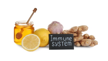 Photo of Set of natural products and card with text Immune System on white background