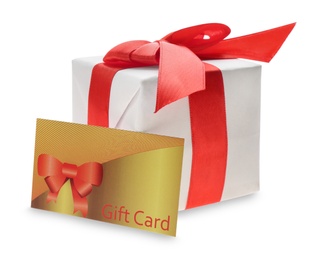 Photo of Gift card and present on white background