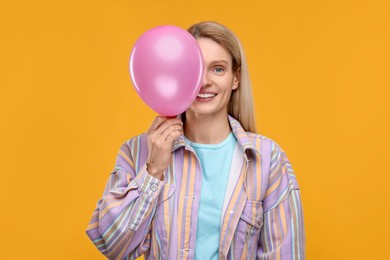 Photo of Woman with air balloon on yellow background