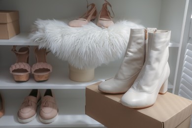 Photo of Different stylish women's shoes in dressing room