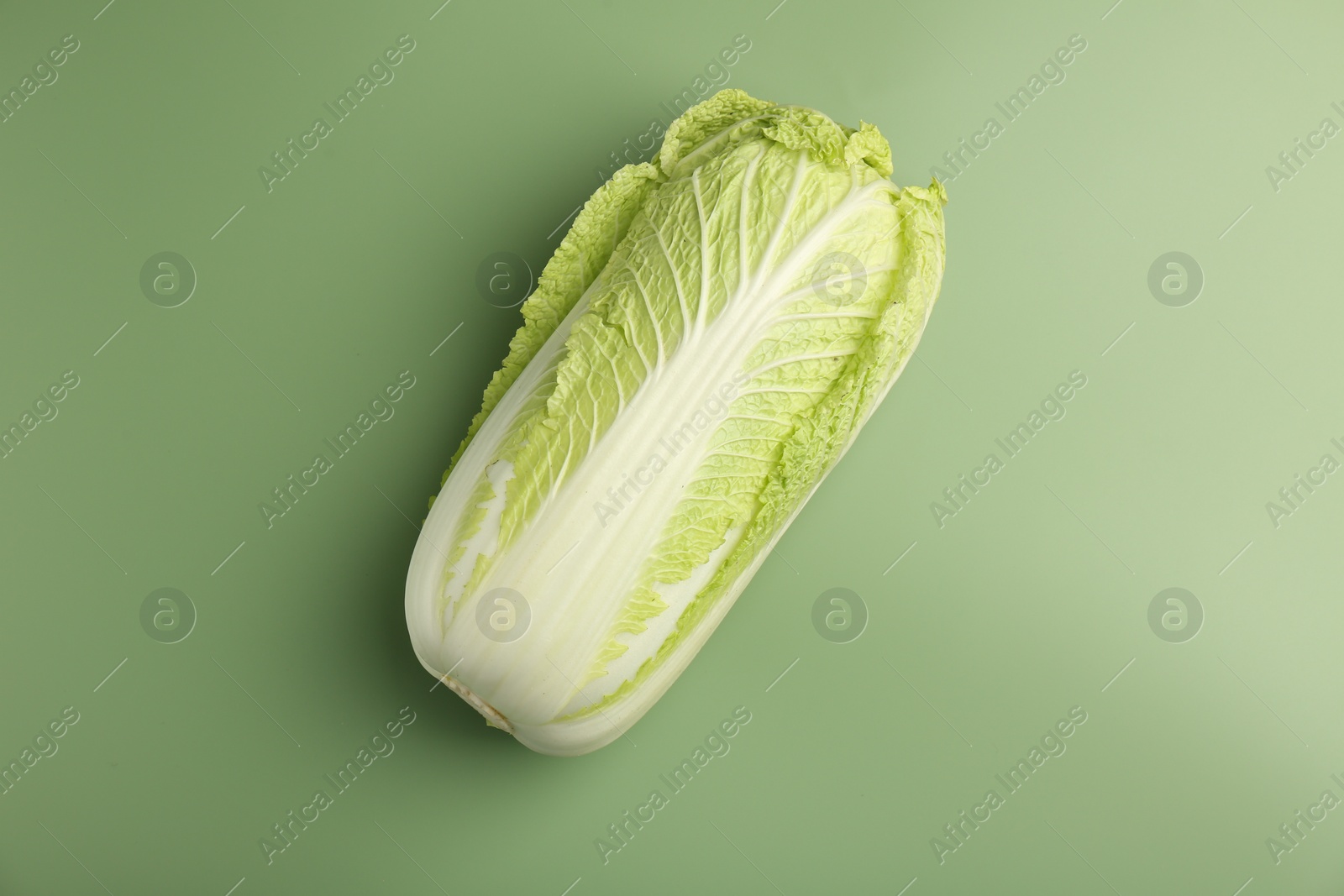 Photo of Fresh ripe Chinese cabbage on pale green background, top view