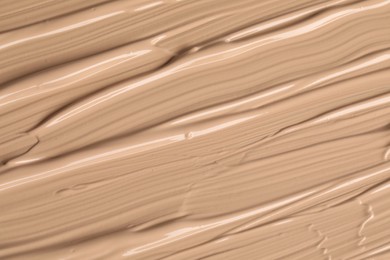 Texture of liquid skin foundation as background, closeup