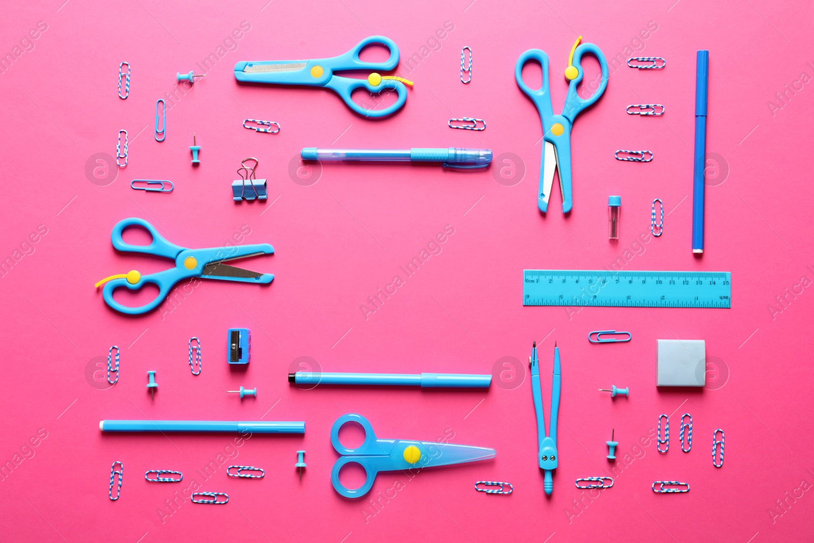 Photo of Flat lay composition with scissors and school supplies on color background. Space for text