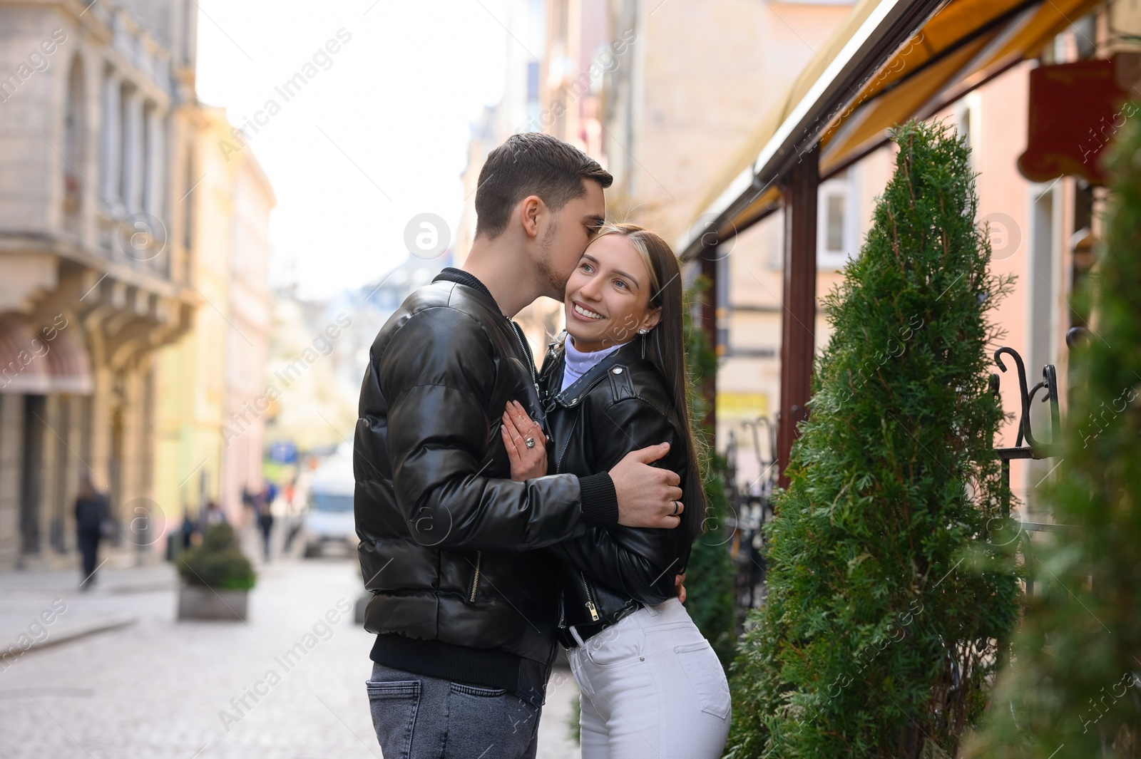 Photo of Lovely young couple enjoying time together outdoors. Romantic date