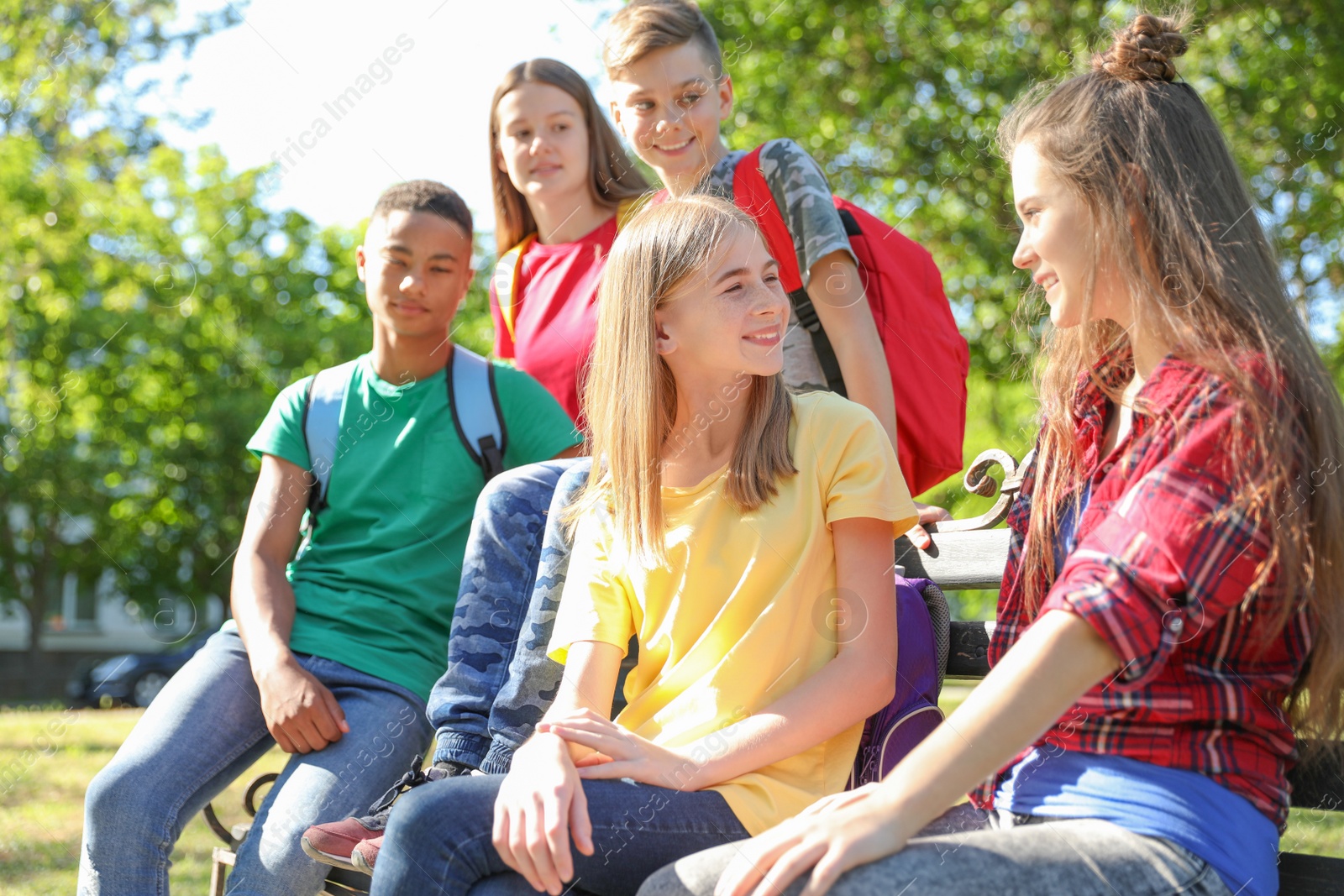 Photo of Group of children outdoors on sunny day. Summer camp